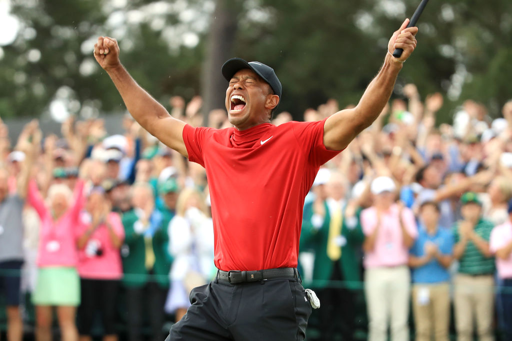 Tiger Woods celebrates after sinking his putt to win during the final round of the Masters at Augusta National Golf Club on April 14, 2019, in Augusta, Georgia. Photo by Andrew Redington/Getty Images