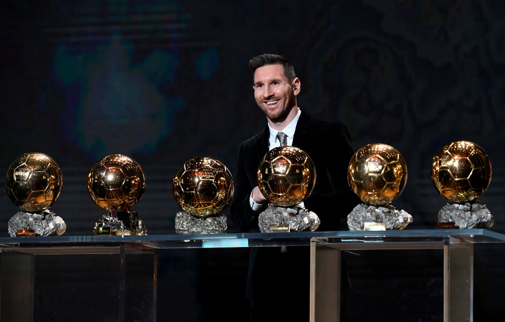 Lionel Messi poses with his six Ballon D'Or 
